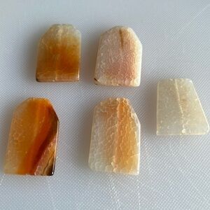 Uruguay, Mexican fire agate. Five pieces. Hand carved and polished.